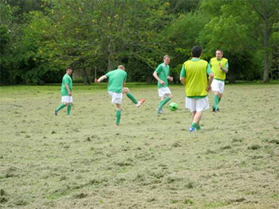 Staff and people supporting sporting the new football kit